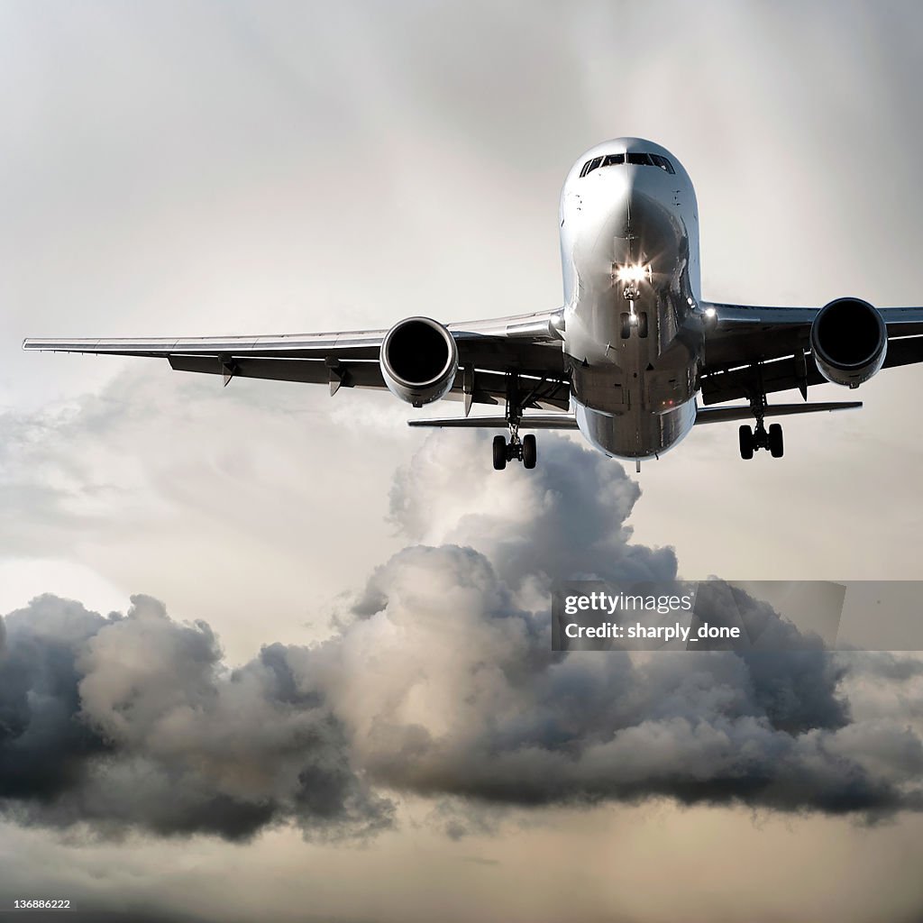 Jet airplane landing in storm