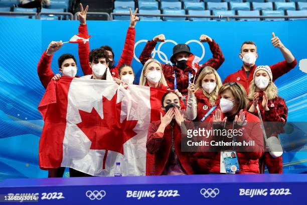 Madeline Schizas of Team Canada reacts with her teammates following her skate in the Women Single Skating Short Program Team Event on day two of the...