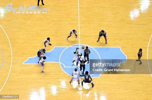 Armando Bacot of the North Carolina Tar Heels and Mark Williams of the Duke Blue Devils tip off to begin their game at the Dean E. Smith Center on...