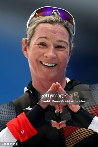 Claudia Pechstein of Team Germany reacts after skating during the Women's 3000m on day one of the Beijing 2022 Winter Olympic Games at National Speed...
