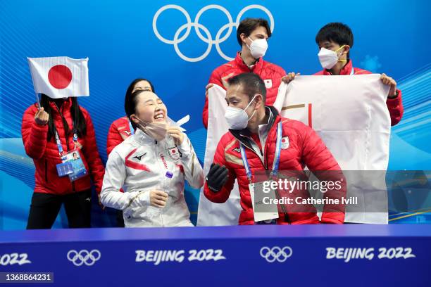 Wakaba Higuchi of Team Japan reacts with teammates following her skate in the Women Single Skating Short Program Team Event on day two of the Beijing...