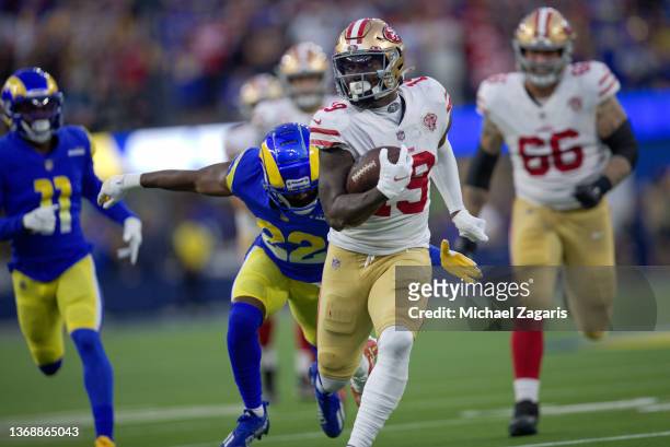 Deebo Samuel of the San Francisco 49ers heads to the end zone on a 44-yard touchdown catch during the game against the Los Angeles Rams at SoFi...