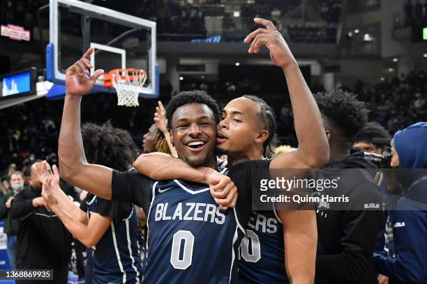 Bronny James and Amari Bailey of Sierra Canyon celebrate after defeating Glenbard West at Wintrust Arena on February 5, 2022 in Chicago, Illinois.