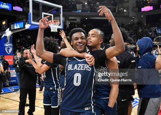 Bronny James and Amari Bailey of Sierra Canyon celebrate after defeating Glenbard West at Wintrust Arena on February 5, 2022 in Chicago, Illinois.