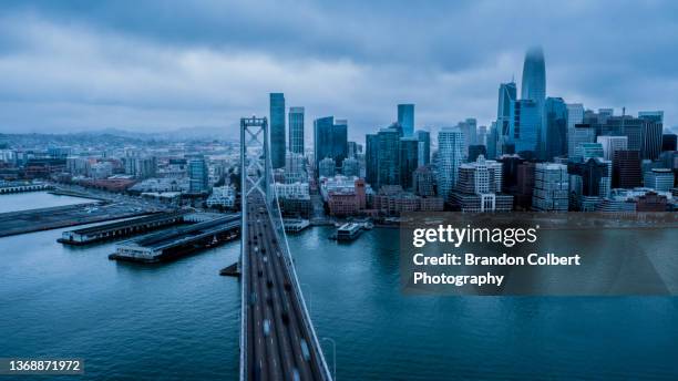 san francisco cityscape - bay bridge stock-fotos und bilder