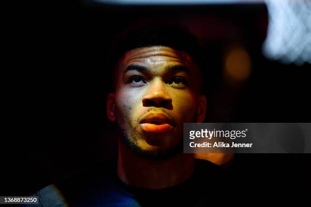 Giannis Antetokounmpo of the Milwaukee Bucks looks on during the playing of the National Anthem before the game against the Portland Trail Blazers at...