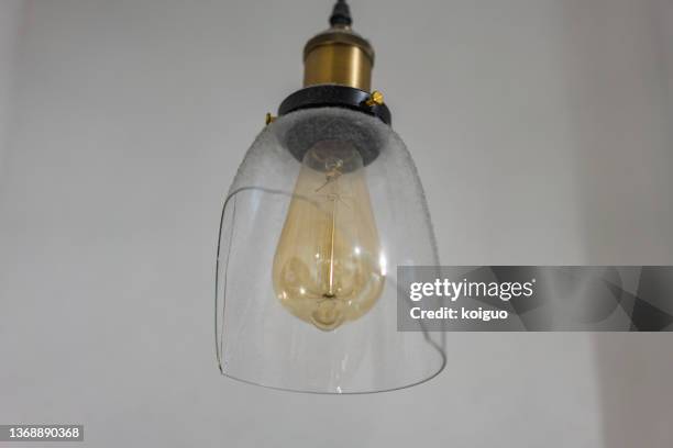 lamp with broken lampshade - broken lamp stockfoto's en -beelden