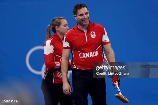 John Morris and Rachel Homan of Team Canada react against Team Czech Republic during the Curling Mixed Doubles Round Robin on Day 2 of the Beijing...