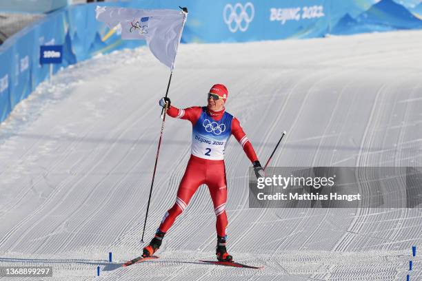 Alexander Bolshunov of Team ROC celebrates winning the gold medal during the Men's Cross-Country Skiing 15km + 15km Skiathlon on Day 2 of the Beijing...