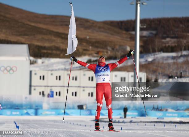 Alexander Bolshunov of Team ROC celebrates winning the gold medal during the Men's Cross-Country Skiing 15km + 15km Skiathlon on Day 2 of the Beijing...