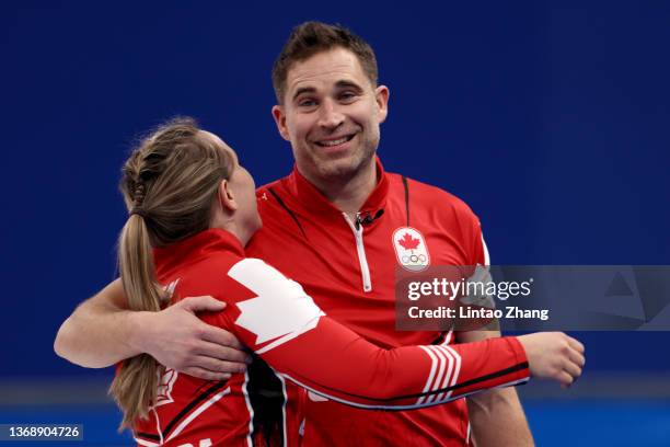 John Morris and Rachel Homan of Team Canada celebrate their win against Team Czech Republic during the Curling Mixed Doubles Round Robin on Day 2 of...