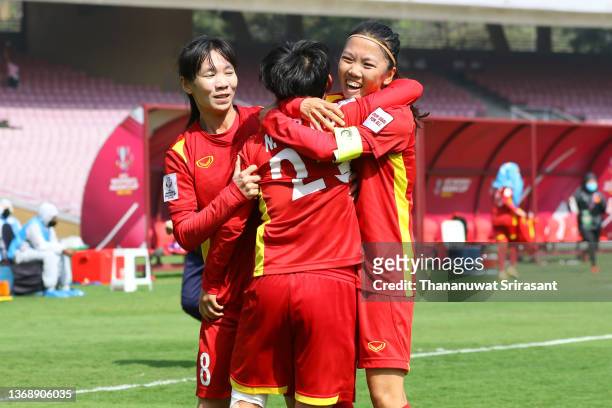 Nguyen Thi Bich Thuy of Vietnam celebrates scoring her side's second goal with her team mates Tran Thi Thuy Trang and Huynh Nhu during the AFC...