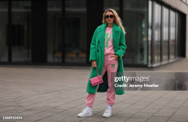 Scarlett Gartmann-Reus wearing Zara green teddy coat, Zara rose matching jogging suit, Bottega Veneta black shades, Nike white sneaker and rose...