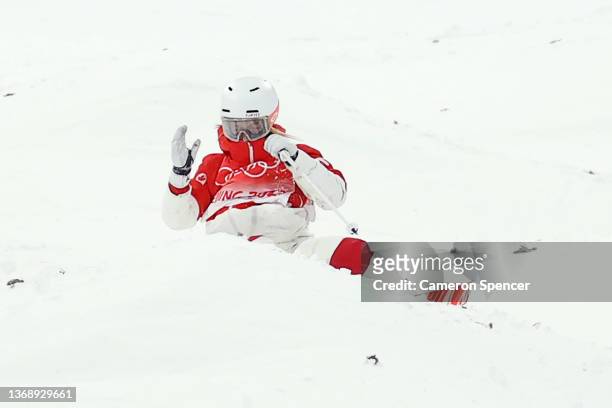 Justine Dufour-Lapointe of Team Canada reacts after crashing on their run during the Women's Freestyle Skiing Moguls Final on Day 2 of the Beijing...