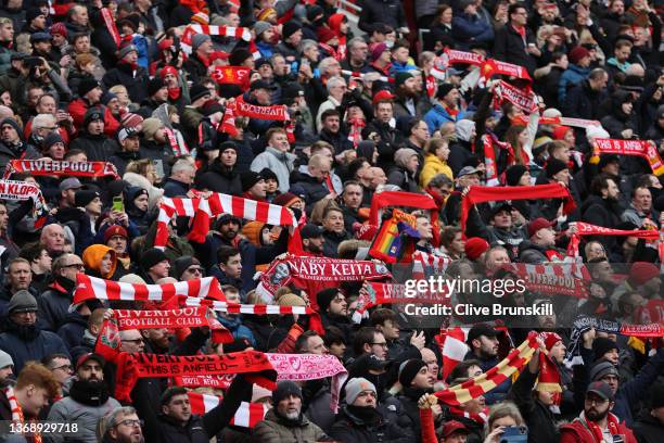 Liverpool fans with raised scarves during the singing of 'You'll never walk alone' during the Emirates FA Cup Fourth Round match between Liverpool...