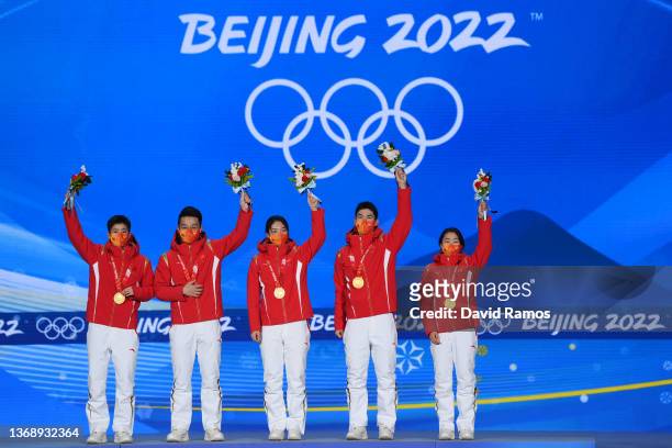 Gold medallists Kexin Fan, Ziwei Ren, Chunyu Qu, Dajing Wu and Yuting Zhang of Team China celebrate during the Mixed Team Relay Speed Skating medal...
