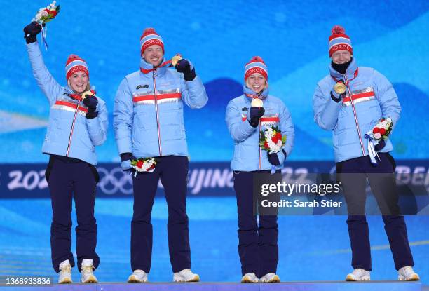 Gold Medalists Marte Olsbu Roeiseland, Tarjei Boe,Tiril Eckhoff and Johannes Thingnes Boe of Team Norway celebrate during the BiathloMixed Relay...