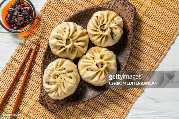 steamed panpao vegan dumplings recipe with chili oil asian food - sesame oil stock pictures, royalty-free photos & images