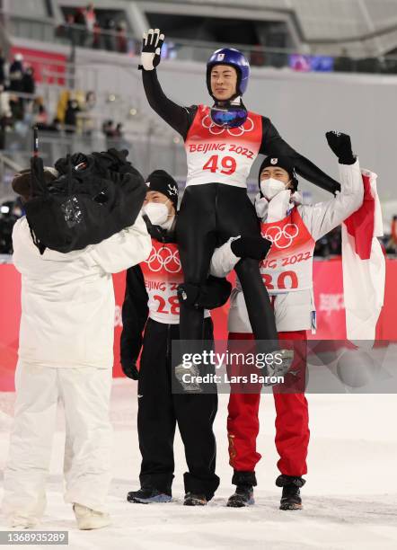 Gold Medalist Ryoyu Kobayashi of Team Japan celebrates after winning Gold with team mates during Men's Normal Hill Individual Final Round at National...