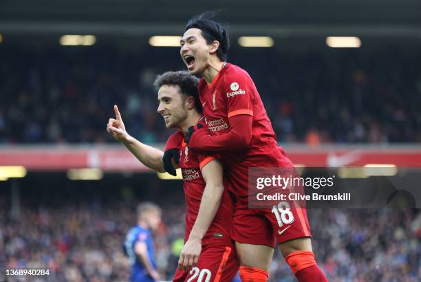 Liverpool player Diogo Jota celebrates with Takumi Minamino after scoring the first goal during the Emirates FA Cup Fourth Round match between...