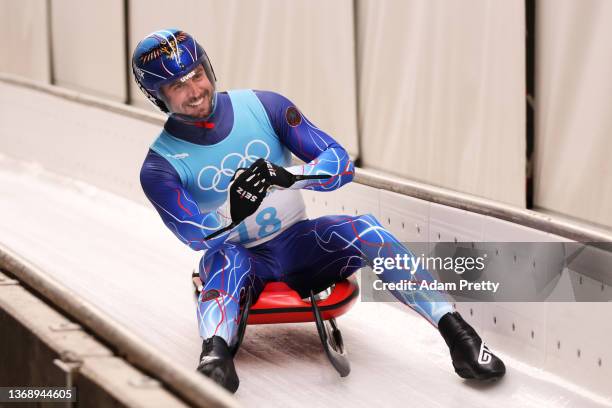 Chris Mazdzer of Team United States reacts while sliding during the Men's Singles Luge Run 4 on day two of the Beijing 2022 Winter Olympic Games at...