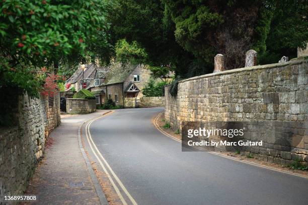 quiet street in the ancient village of chipping campden, the cotswold way, the cotswolds, england - english village stock pictures, royalty-free photos & images