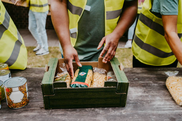 20 Best Non-Profit Business Ideas You Can Start 1 male volunteer arranging food packets in