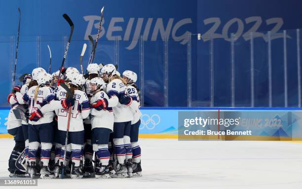 Team United States celebrate their 8-0 win over Team Switzerland during the Women's Preliminary Round Group A match at Wukesong Sports Center on...