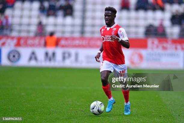 Nathanael Mbuku of Stade de Reims runs with the ball during the Ligue 1 Uber Eats match between Reims and Bordeaux at Stade Auguste Delaune on...
