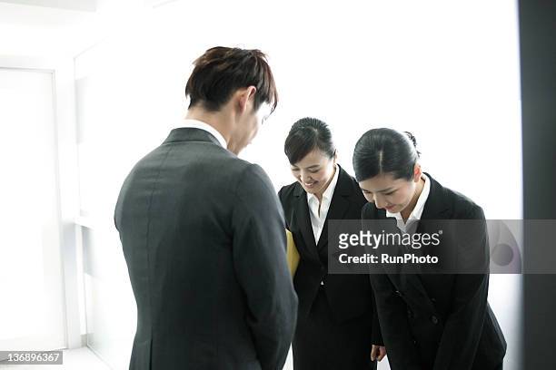 businessman&businesswomen in the office - japanese respect stock pictures, royalty-free photos & images