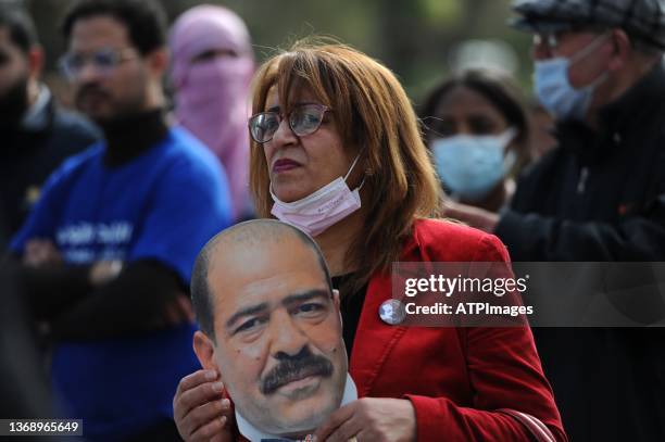 People gather for a demonstration in the capital Tunis on February 6 marking the anniversary of the assassination of Tunisian leftist politician...