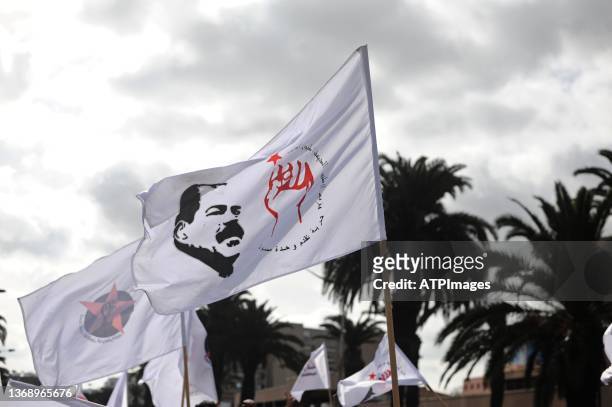 People gather for a demonstration in the capital Tunis on February 6 marking the anniversary of the assassination of Tunisian leftist politician...