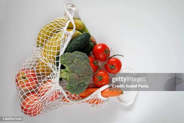 fruits and vegetables in reusable shopping bag - vegetables isolated stock pictures, royalty-free photos & images