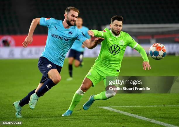 Renato Steffen of VfL Wolfsburg challenges Simon Asta of SpVgg Greuther Fürth during the Bundesliga match between VfL Wolfsburg and SpVgg Greuther...