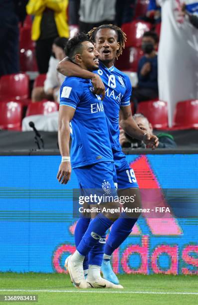 Salem Aldawsari celebrates with teammate Andre Carillo of Al Hilal after scoring their team's fourth goal during the FIFA Club World Cup UAE 2021 2nd...