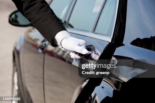 Chauffeur opening / closing luxury car door Chauffeur opening / closing luxury car door