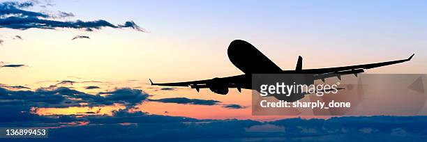 xl jet airplane taking off at dusk - tourism industry stock pictures, royalty-free photos & images