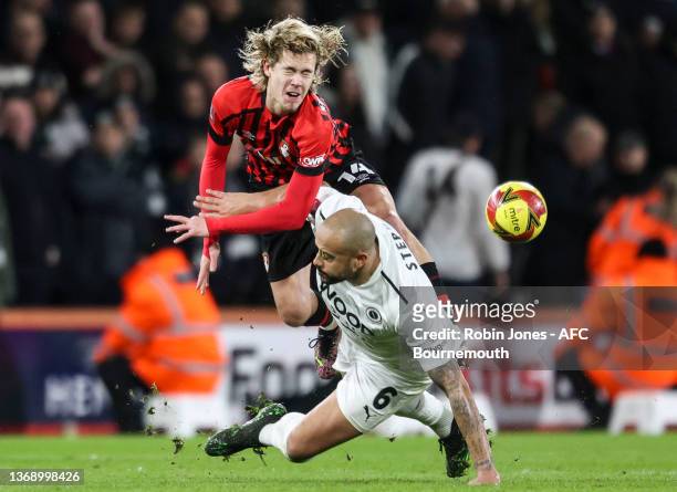David Stephens of Boreham Wood FC clatters into Todd Cantwell of Bournemouth during the Emirates FA Cup Fourth Round match between AFC Bournemouth...
