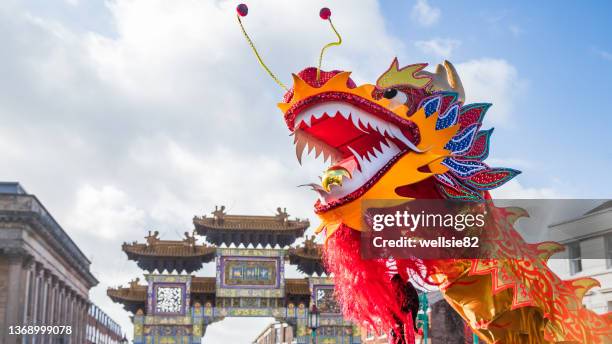 chinese dragon under a bright sky - kung hei fat choi stock-fotos und bilder