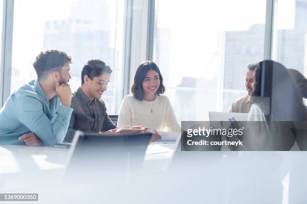 diverse group of business people during a meeting. - round table stock pictures, royalty-free photos & images