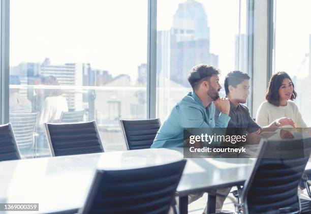 diverse group of business people during a meeting with copy space. - round table discussion stock pictures, royalty-free photos & images