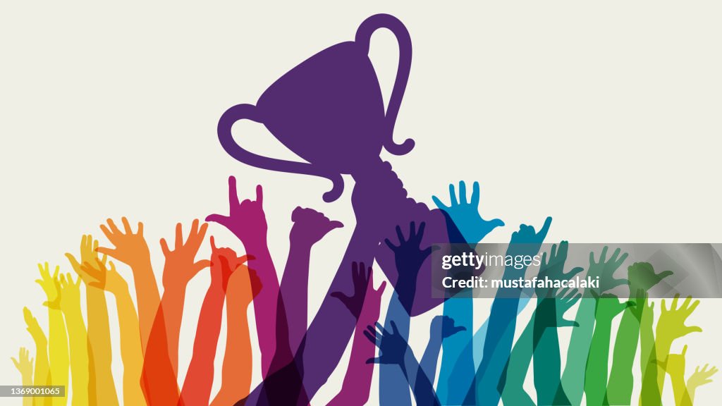 Raised rainbow arms with trophy