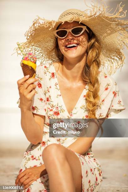 enjoying morning with ice cream on vacation - cream colored hat stock pictures, royalty-free photos & images