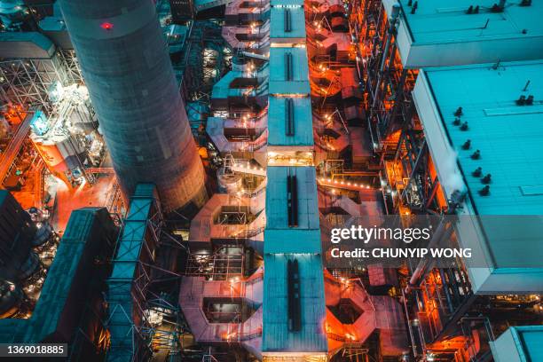 coal-fired power station bei nacht - hochspannungstransformator stock-fotos und bilder