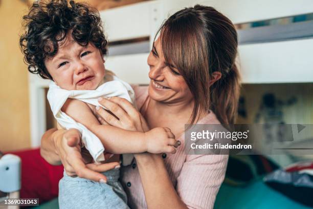 mother and son at home - toddler tantrum stock pictures, royalty-free photos & images
