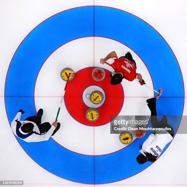 Amos Mosaner and Stefania Constantini of Team Italy compete against John Morris of Team Canada during the Curling Mixed Doubles Round Robin on Day 3...