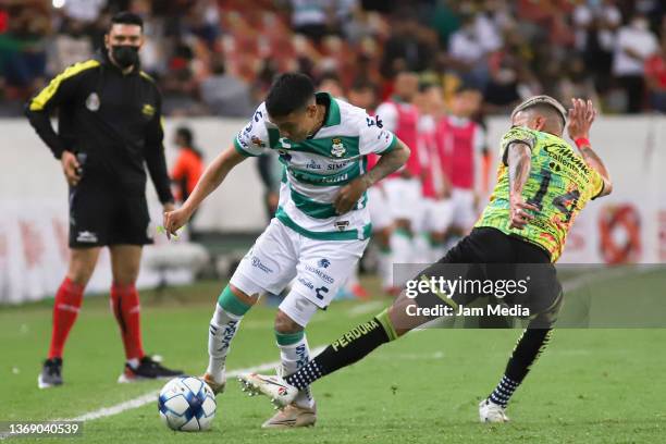 Luis Reyes of Atlas fights for the ball with Leonardo Suarez of Santos during the 4th round match between Atlas and Santos Laguna as part of the...