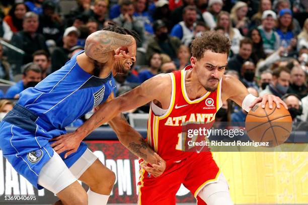 Trae Young of the Atlanta Hawks drives against Trey Burke of the Dallas Mavericks in the second half at American Airlines Center on February 06, 2022...