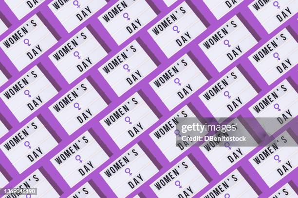 lightbox pattern with a woman's symbol in purple and text that reads: 'women's day' on a purple background. concept of women's day, empowerment, equality, inequality, activism and protest. - womens day imagens e fotografias de stock