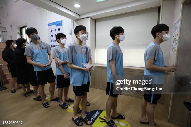 Teenagers wait in line for an X-ray test during physical examinations for conscription at the South Korean Military Manpower Administration on...